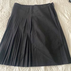 Beautiful dressy dark grey skirt with pleats on one side. Theory size 4.